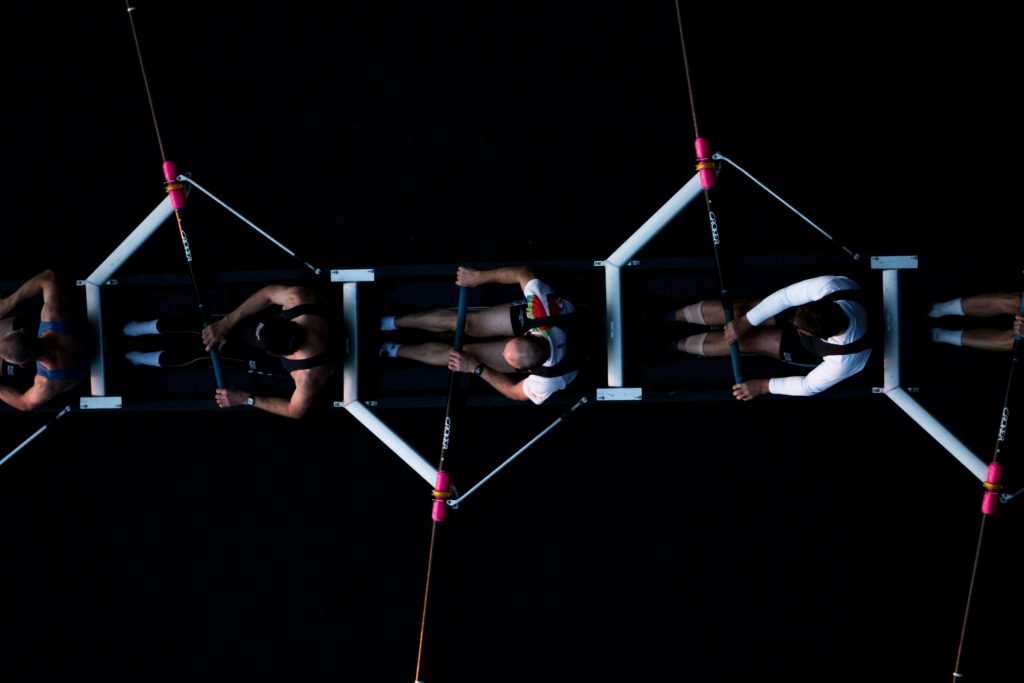 A view from above of people rowing in a boat