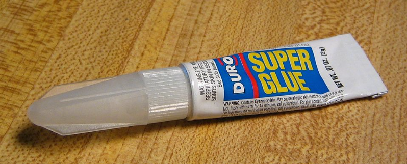 A tube of Super Glue, representing the importance of glue work in digital transformation