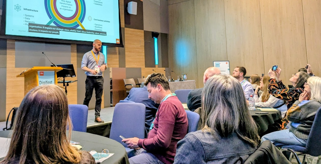 Dan Hughes presenting to an audience at Digifest