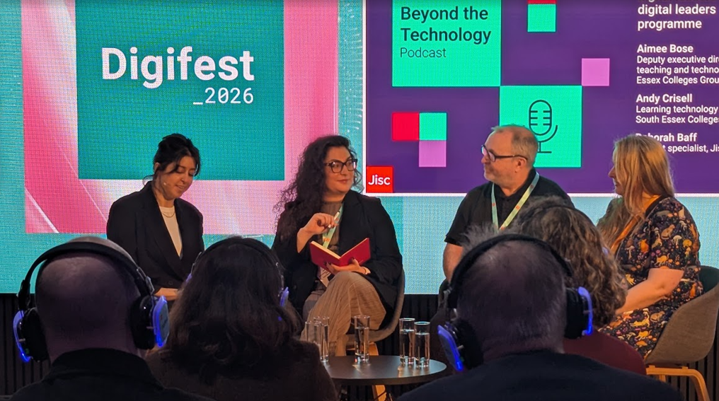 Panelists talking during a podcast recording at Digifest. 